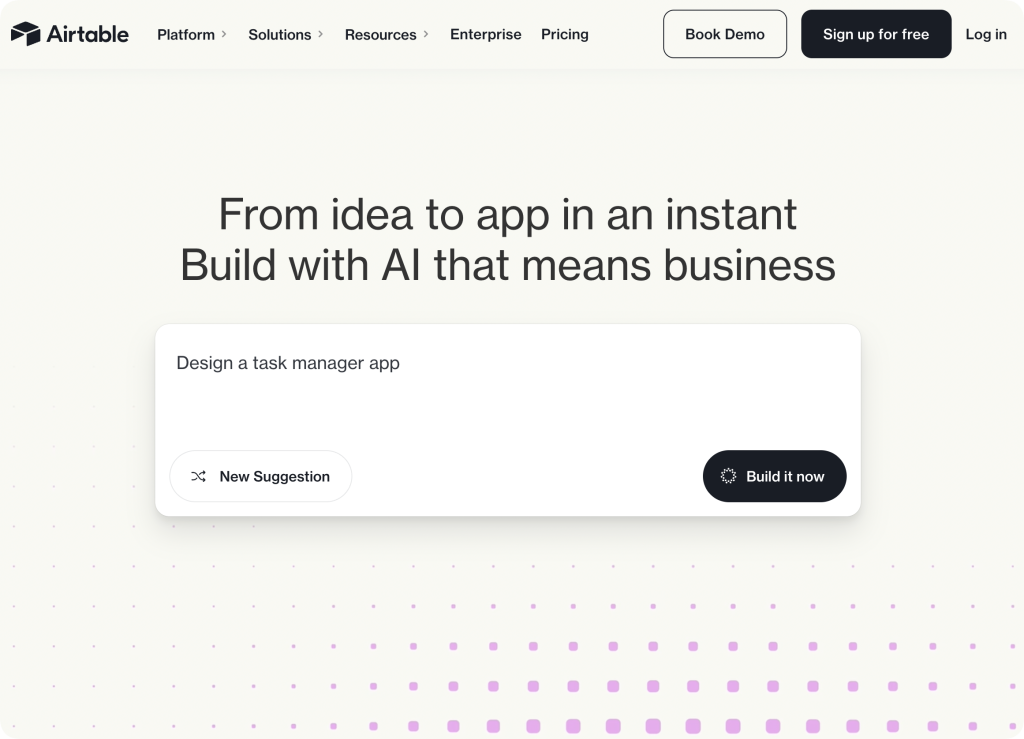 Airtable homepage with headline “From idea to app in an instant. Build with AI that means business” and a prompt box suggesting “Design a task manager app” with buttons for “New Suggestion” and “Build it now.”