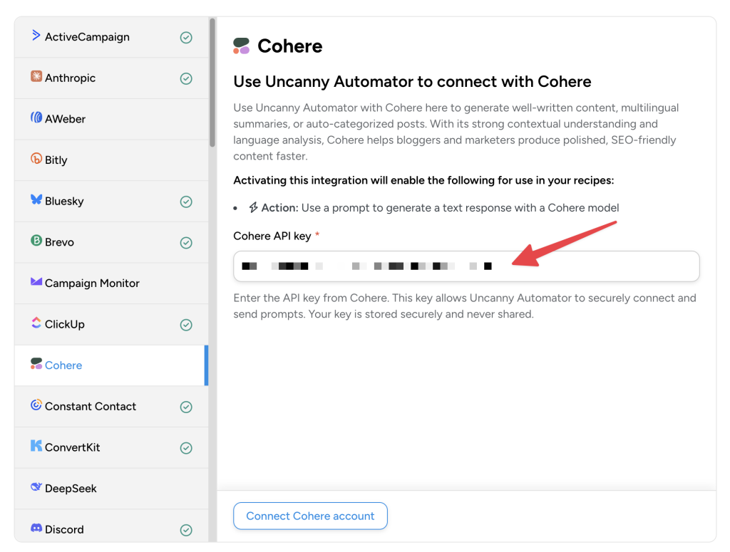 Uncanny Automator app integration screen for Cohere, with a red arrow pointing to the “Cohere API key” field for users to connect their Cohere account.